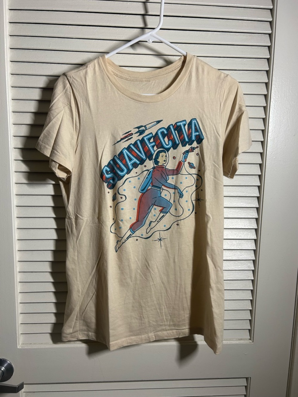 Suavecita Cream Graphic Tee with Retro Astronaut Illustration